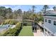 Aerial view of a landscaped backyard with pool and playset, perfect for outdoor living and recreation at 740 Stucco Ln, Mount Pleasant, SC 29464