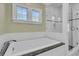 Bright bathroom features a soaking tub and a glass shower at 740 Stucco Ln, Mount Pleasant, SC 29464