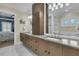 Primary bathroom with double vanity, large mirror, and a view to the bedroom at 740 Stucco Ln, Mount Pleasant, SC 29464