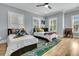 Bright bedroom with two beds, ceiling fan, and a playful rug, perfect for children at 740 Stucco Ln, Mount Pleasant, SC 29464
