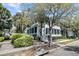 Beautiful two-story home showcasing a welcoming porch and lush landscaping at 740 Stucco Ln, Mount Pleasant, SC 29464