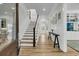 Elegant foyer with hardwood floors, staircase, and access to living areas at 740 Stucco Ln, Mount Pleasant, SC 29464