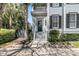 Charming home's entrance features a quaint porch and well-manicured landscaping at 740 Stucco Ln, Mount Pleasant, SC 29464