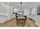 Well-appointed kitchen with stainless steel appliances, custom cabinetry, island, and a dining area at 740 Stucco Ln, Mount Pleasant, SC 29464