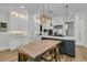 Modern kitchen with island, white cabinets, and stainless steel appliances at 740 Stucco Ln, Mount Pleasant, SC 29464