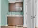 Convenient kitchenette features a sink, microwave, refrigerator, and ample cabinet space at 740 Stucco Ln, Mount Pleasant, SC 29464