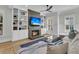 Relaxing living room with fireplace, built-in shelving, and large windows offering scenic views at 740 Stucco Ln, Mount Pleasant, SC 29464