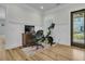 Home office featuring wainscoting, a peloton, and a dark stained wood desk at 740 Stucco Ln, Mount Pleasant, SC 29464