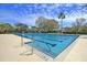 Outdoor community swimming pool with clear blue water, marked lanes, and surrounding patio area on a sunny day at 740 Stucco Ln, Mount Pleasant, SC 29464
