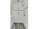 Modern tiled shower with multiple shower heads and glass door at 740 Stucco Ln, Mount Pleasant, SC 29464