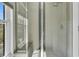 Modern shower features glass doors and tiled walls, adjacent to a window at 740 Stucco Ln, Mount Pleasant, SC 29464