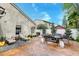 Back yard with stamped concrete patio, seating, privacy fence and landscaping. Ready to enjoy! at 8095 Old London Rd, North Charleston, SC 29406