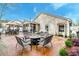 Backyard patio features a fire pit, table, and outdoor seating, creating a cozy and inviting outdoor space at 8095 Old London Rd, North Charleston, SC 29406