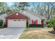 Inviting single-story home with a brick facade, red front door and window shutters, plus a well-kept front yard at 8095 Old London Rd, North Charleston, SC 29406