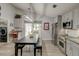 Open kitchen with a stainless refrigerator, large island, and sliding door access to outside at 8095 Old London Rd, North Charleston, SC 29406