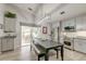 Modern kitchen features gray cabinets, stainless steel appliances, and ample natural light from the sliding glass door at 8095 Old London Rd, North Charleston, SC 29406