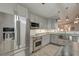 Renovated kitchen with stainless steel appliances, subway tile backsplash, and gray cabinets at 8095 Old London Rd, North Charleston, SC 29406