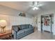 Living room features comfortable sofa, side table with lamp, wainscotting and built-in bookshelves at 8095 Old London Rd, North Charleston, SC 29406