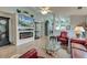 Bright living room featuring a modern fireplace and a stunning view into the kitchen, perfect for entertaining at 8095 Old London Rd, North Charleston, SC 29406