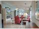 Open-concept living room features stylish furnishings, fireplace, ceiling fan, and wood floors at 8095 Old London Rd, North Charleston, SC 29406