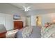 Comfortable bedroom featuring a TV, ensuite bathroom, walk-in closet and bright natural light at 8095 Old London Rd, North Charleston, SC 29406