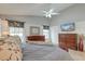 Bright main bedroom with vaulted ceilings, decorative accents, and a view of the mounted television at 8095 Old London Rd, North Charleston, SC 29406