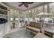 Relaxing screened porch with comfortable seating, providing a serene view of the private backyard at 8095 Old London Rd, North Charleston, SC 29406
