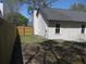 Backyard view with fence and newly renovated vinyl siding at 8311 Whitehaven Dr, North Charleston, SC 29420
