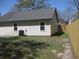 View of backyard with wood fence and AC unit at 8311 Whitehaven Dr, North Charleston, SC 29420