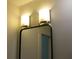 Bathroom vanity with sconces illuminating a frameless mirror at 8311 Whitehaven Dr, North Charleston, SC 29420