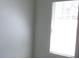 Bedroom with a large window providing natural light and neutral colored walls at 8311 Whitehaven Dr, North Charleston, SC 29420