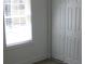 Bedroom with a window and a closet with white bi-fold doors at 8311 Whitehaven Dr, North Charleston, SC 29420