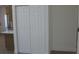 Interior view showcasing a closet and an adjacent counter with a stainless-steel refrigerator at 8311 Whitehaven Dr, North Charleston, SC 29420
