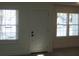 Interior view showcasing two windows and an interior door at 8311 Whitehaven Dr, North Charleston, SC 29420