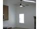 Bright living room with a ceiling fan, window, and a stone fireplace at 8311 Whitehaven Dr, North Charleston, SC 29420