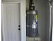 Water heater with updated plumbing and adjacent to a door at 8311 Whitehaven Dr, North Charleston, SC 29420