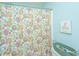 Cozy bathroom with a floral shower curtain, toilet, and clean aesthetic at 1002 Elm Hall Cir, Summerville, SC 29483