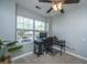 Bedroom setup as a home office with neutral walls, soft carpet, and bright light at 1002 Elm Hall Cir, Summerville, SC 29483