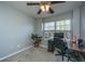 Bedroom setup as a home office with neutral walls, soft carpet, and a ceiling fan at 1002 Elm Hall Cir, Summerville, SC 29483