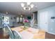 Cozy dining area with natural light and open layout to living room and staircase at 1002 Elm Hall Cir, Summerville, SC 29483
