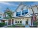 Charming townhouse exterior with a quaint front porch and well-maintained landscaping at 1002 Elm Hall Cir, Summerville, SC 29483