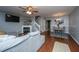 Cozy living room featuring a fireplace, television, and open dining area at 1002 Elm Hall Cir, Summerville, SC 29483