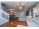 Open concept living space with a comfortable gray sectional and dining area at 1002 Elm Hall Cir, Summerville, SC 29483