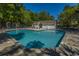 Inviting in-ground pool surrounded by plenty of seating and lush trees at 1002 Elm Hall Cir, Summerville, SC 29483