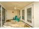 Relaxing screened porch with seating and fan at 1002 Elm Hall Cir, Summerville, SC 29483
