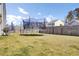 Spacious backyard with a trampoline, grill, and a privacy fence at 101 Corvus Ct, Summerville, SC 29486