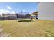 Backyard with trampoline, grill, and covered patio for outdoor fun and relaxation at 101 Corvus Ct, Summerville, SC 29486
