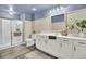 Modern bathroom featuring a glass-enclosed shower, dual-flush toilet and a vanity with white cabinets and brushed-nickel hardware at 101 Corvus Ct, Summerville, SC 29486
