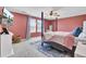 Bright bedroom with a four-poster bed, natural light, and a wall-mounted TV at 101 Corvus Ct, Summerville, SC 29486