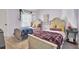 Bedroom featuring two twin beds, a window providing natural light, and complemented by soft, lavender walls at 101 Corvus Ct, Summerville, SC 29486